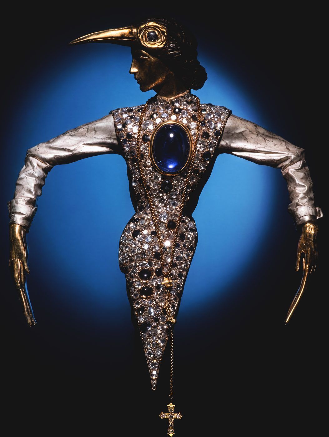 Bird of Pray Brooch by Nilofar — a one-of-a-kind 14k gold figure set with over 400 pavé colored diamonds and a bezel-set sapphire cabochon